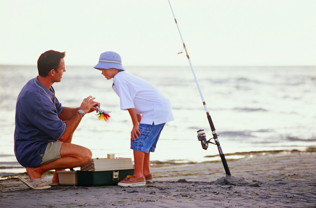 Father teaching son how to fish - Margaritaville Blog