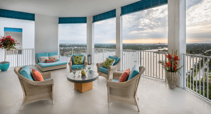 Balcony with a small table and four chairs