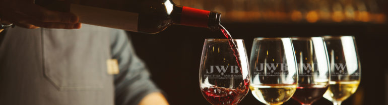JWB wine glasses being filled
